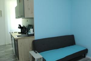 a room with a bench in a kitchen at Royal Racing Suite Top 2 near Red Bull Ring in Judenburg