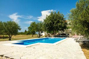 a swimming pool in a yard with trees at My Dalmatia - Villa Mandorla with private pool and Jacuzzi in Zadar +72 photos