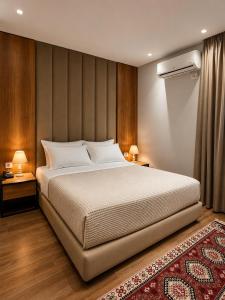 a bedroom with a large bed and two night stands at 313 Villa City Center in Tirana