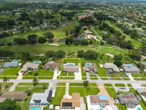 an aerial view of a park with houses at 3BR Pool Villa on Golf Course Huge Yard & Games in Wellington +55 photos