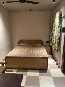a bedroom with a bed in a room at Hotel ranjeet in Alīgarh