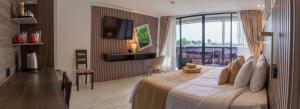 a bedroom with a large bed and a balcony at Plaza Lobos in Puerto Baquerizo Moreno +9 photos