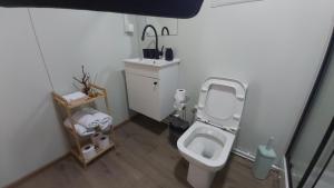 a small bathroom with a toilet and a sink at Resort-Music Mostar in Potoci