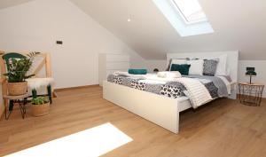 a bedroom with a bed and a skylight at Old town Bol apartments in Bol