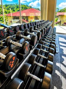 a row of dumbbells lined up in a gym at L'Eskale Guyane in Montjoly