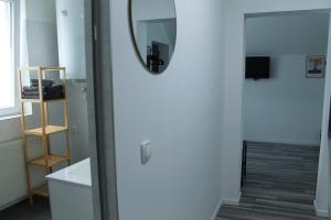 a room with a door and a mirror and a staircase at Royal Racing Suite Top 6 near Red Bull Ring in Judenburg