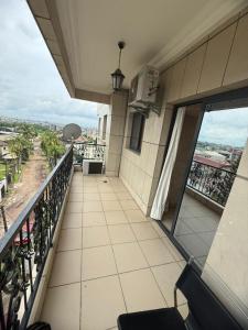 a balcony of a building with a view of a city at Etienne Gae 2 in Douala