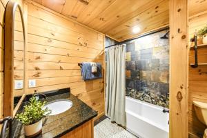 a bathroom with a sink and a shower at Heavenly Daze Amazing Mountain View, Hot Tub, Game Room! in Sevierville +25 photos