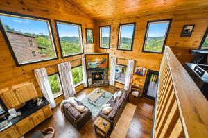 an overhead view of a living room with large windows at Heavenly Daze Amazing Mountain View, Hot Tub, Game Room! in Sevierville