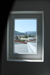 a window in a room with a view of a building at Royal Racing Suite Top 1 near Red Bull Ring in Judenburg