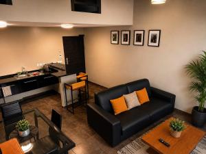 a living room with a couch and a table at L'Eskale Guyane in Montjoly
