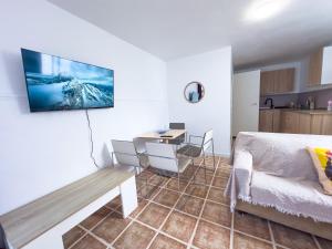a bedroom with a bed and a desk in a room at Bungalow and private XXL Terrace in Alicante