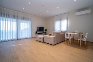 a living room with a couch and a table at Anemi Residence in Chios