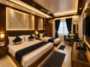 a hotel room with two beds and a desk at Hotel Montanaa Plaza Near Delhi Airport - Free Airport Pickup & Drop and Breakfast- Dinner complementary in New Delhi