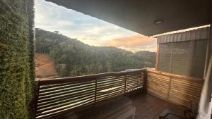 a balcony with a view of a mountain at Front in Domingos Martins