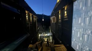 a view of an alley between two train cars at Front in Domingos Martins