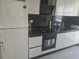 a kitchen with a refrigerator and a stove at rental per night in Nabeul