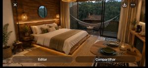 a bedroom with a bed and a balcony with a hammock at Avocado in Domingos Martins