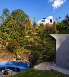 a view of a garden with a dome in the background at Hichata Breakfast Included in La Calera