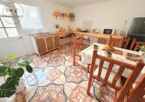 a kitchen with a table and chairs in a room at Taltal - Casa Dominguez in Taltal +10 photos