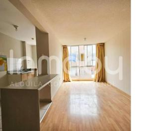 an empty living room with a large window at Torre in Carabayllo