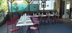 a group of tables and chairs in a restaurant at Auberge de Barnas in Barnas