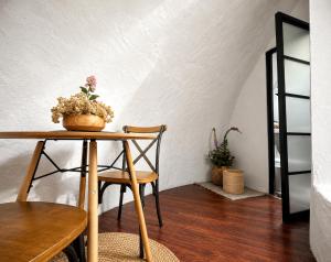a table with a potted plant on top of it at Hichata Breakfast Included in La Calera +20 photos