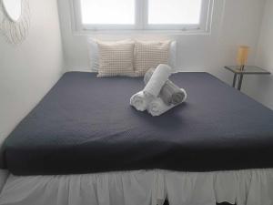 a bed with towels on it in a bedroom at LISBD7D - JL Condado in San Juan