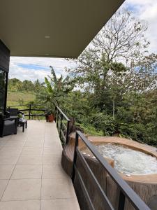 a jacuzzi tub on the deck of a house at Yalala Jacuzzi in Jabillos