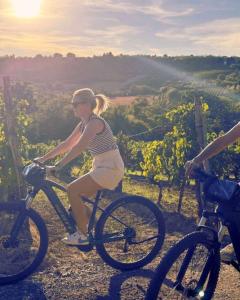 a young woman riding a bike on a hill at Matea Slow Living Home Private Retreat in Čortanovci
