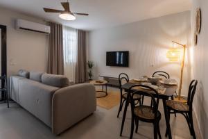 a living room with a couch and a table at D'stay by Dastid in Golem