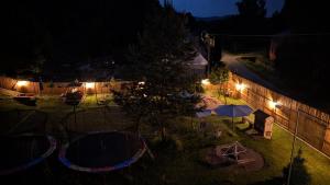 an overhead view of a yard at night with lights at Penzion Ruprechtice in Mezimesti
