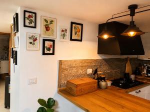 a kitchen with a wooden counter top in a room at Casa Maria in Scauri +27 photos