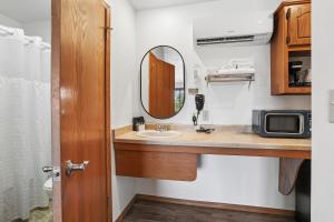 a bathroom with a sink and a mirror at Parkside Inn in Ellison Bay +32 photos