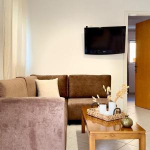 a living room with a couch and a table at Dimitra's House in Kefalos