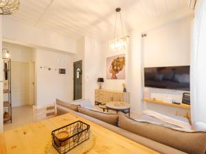 a living room with a couch and a table at Nena's Volto, Campiello living in Corfu