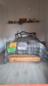 a bedroom with a bed with a blanket on it at Casa eclipse in Padilla de Abajo
