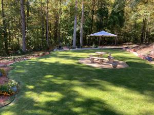 a park with a picnic table and an umbrella at The Abigail in Braselton