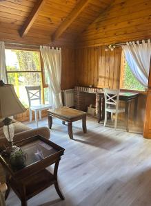 a living room with a couch and a table at Santa Monica Aparts in El Calafate