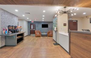 a large room with a kitchen and a living room at Extended Stay America Select Suites - Charlotte - Tyvola Rd in Charlotte