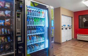 a refrigerator filled with lots of bottles of soda at Extended Stay America Suites - San Diego - Oceanside in Oceanside