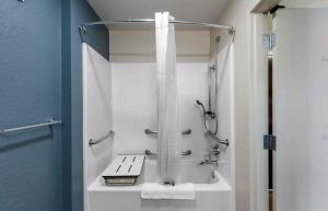 a bathroom with a shower and a bath tub at Extended Stay America Suites - Fremont - Warm Springs in Warm Springs District +44 photos