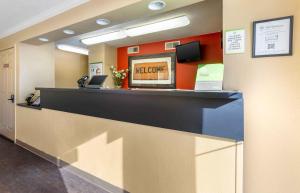 a lobby with a reception desk with a welcome sign at Extended Stay America Select Suites - Phoenix - Mesa - West in Mesa