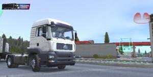 a white semi truck driving down a street at Oussoumana in Matamey