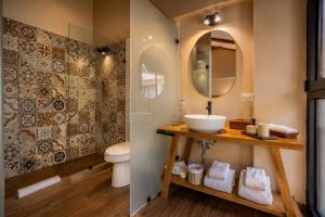 a bathroom with a sink and a toilet at Sierra Sacred Valley in Urubamba