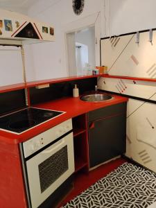 a small kitchen with a sink and a stove at BLR Apartment in Graz