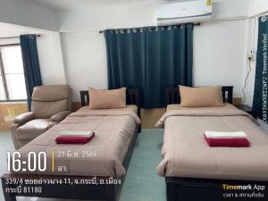 a room with two beds and a couch at Ao Nang Room And Bike 10 in Ao Nang 