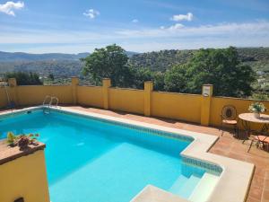 a swimming pool on top of a house at Villa in Andalusia with Private Pool in Fuentes de Cesna