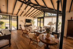 a living room with a couch and a table at Sierra Sacred Valley in Urubamba