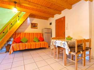 a living room with a table and a couch at Apartments Fazanka 849 in Fažana